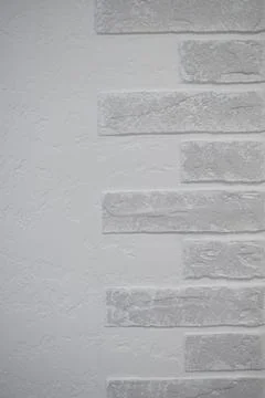 Background of a white wall inside the building, a strip of plaster wall and half Stock Photos