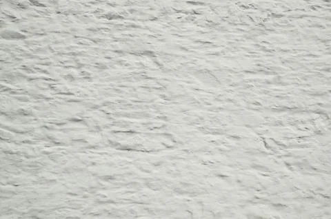 Background of whitewashed old stone wall that is rough and grung Stock Photos