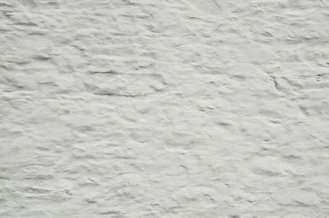 Background of whitewashed old stone wall that is rough and grung Stock Photos