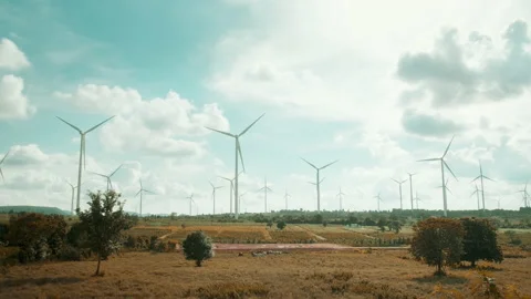 Background of wind turbines fields over blue sky ,  ecological conservation c Stock Footage 208699341
