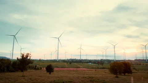 Background of wind turbines fields at sunset , ecological conservation concep Stock Footage 208698966