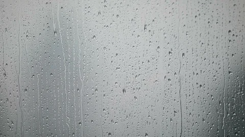 Background of a window with raindrops outside falling down Video stock 91560491