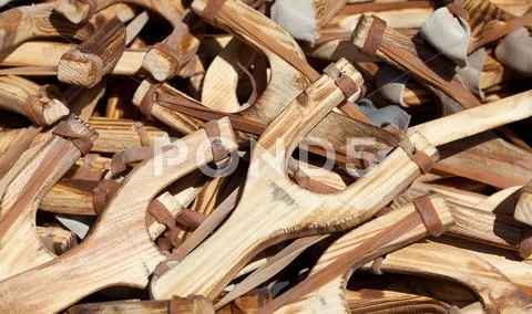 Background of wooden slingshots at the fair Stock Photos