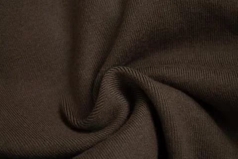 Background of woolen knitted brown sweater top view, cloth sample concept Stock Photos