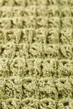 Background of woolen threads of olive color. Stock Photos