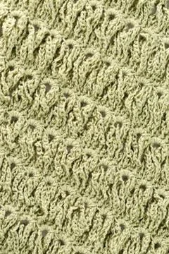 Background of woolen threads of olive color. Stock Photos