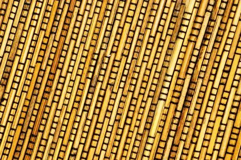Background of woven rods. Stock Photos