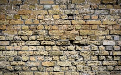 Background of yellow brick texture. Brick wall pattern Stock Photos