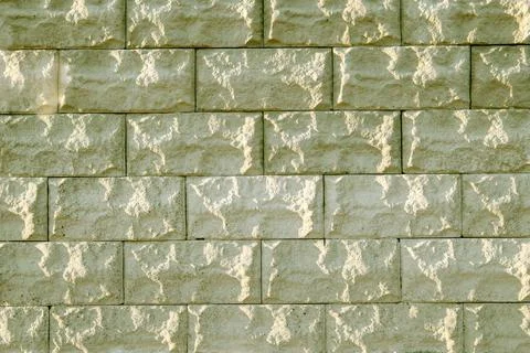Background of yellow bricks. Wall of yellow bricks. The texture of the wall.  Stock Photos