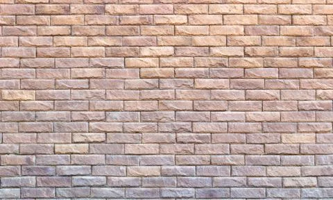Background of yellow facing bricks. Bricks relief close up. Foto stock
