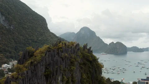 Background/Foreground moving drone shot of rock formations at the ocean Stock Footage 103455210