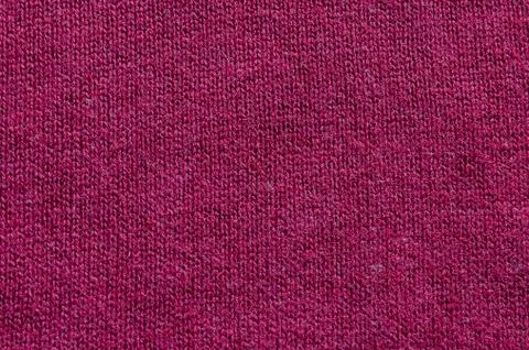 Backgrounds and textures. Maroon knitted fabric. Fine knit. Stock Photos
