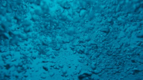 Backgrounds underwater. air bubbles rising up to the surface Stock Footage 128454755