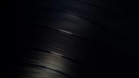 Background,spinning black vinyl record with light reflected in it. Stock Footage 308796068