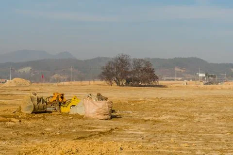 Backhoe attachments on ground Stock Photos