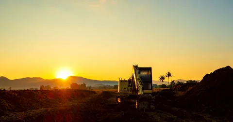 A Backhoe in a construction site in the morning Stock Footage 259755064