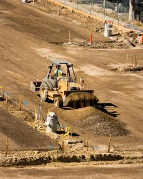 Backhoe at Construction Site Photos