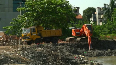 Backhoe Digger and Dump Truck Video stock 122857158