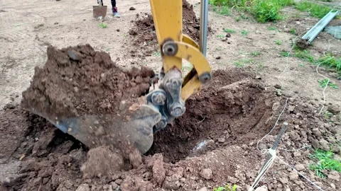 Backhoe digging ground construction machinery slow motion Vidéo 333097605