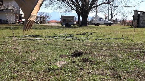 Backhoe digging a hole in a field Stock Footage 73442402