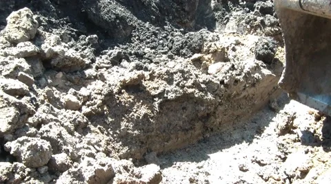 Backhoe Digging in Sunlight Video stock 65743891