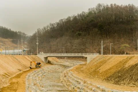 Backhoe at edge of ravine Stock Photos
