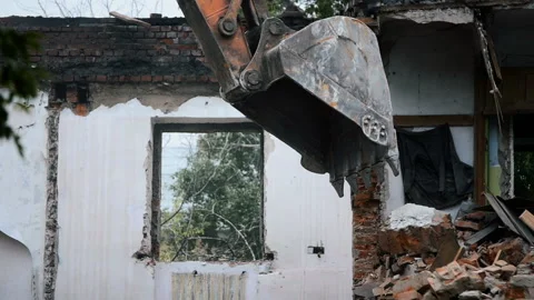 Backhoe excavate broken bricks Stock Footage 98851688