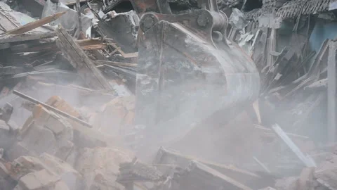 The backhoe excavate broken bricks Stock Footage 98852922