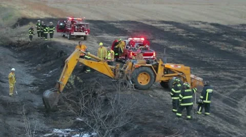 Backhoe Firefighting Stock-Footage 12439074