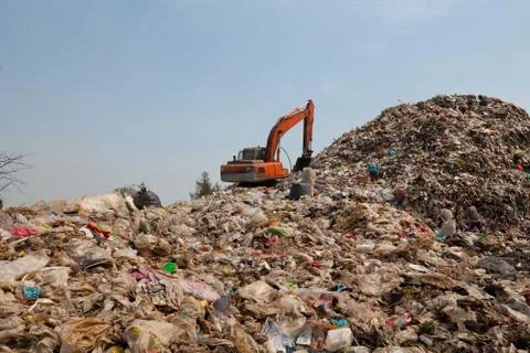 Backhoe at garbage dump Stock Photos