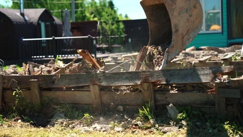 Backhoe Loader Bucket Crushing Wooden Formwork And Rubble Stock Footage 337830650