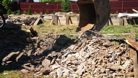 Backhoe Loader Bucket Sifting Concrete Rubble And Rebar Stock Footage 337830692