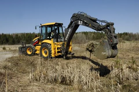Backhoe loader digging Stock Photos