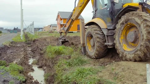 Backhoe loader digging soil. Construction site Video stock 73042854