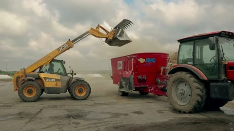 Backhoe Loader JCB on farm. Kyiv. Ukraine. 1.05.2022 Stock Footage 192366396