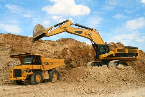 Backhoe loader loading dumper Stock Photos