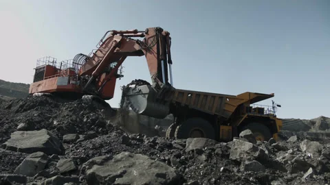 Backhoe loader loading dumper truck Stock Footage 205241136