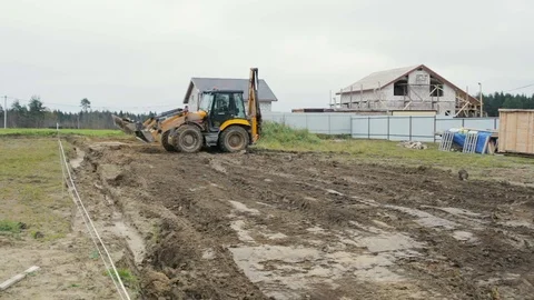 Backhoe loader makes the work at the construction site. Video stock 73042821