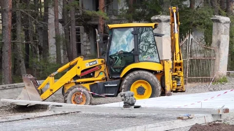 Backhoe loader moving gravel on construction site Stock-Footage 307866353
