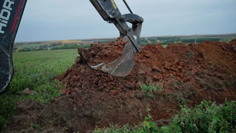 Backhoe loader performs excavation work with digging boom Stock Footage 346176046