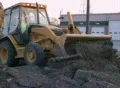 Backhoe Loader Pushing Pavement Footage