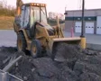 Backhoe Loader Pushing Pavement SD Footage