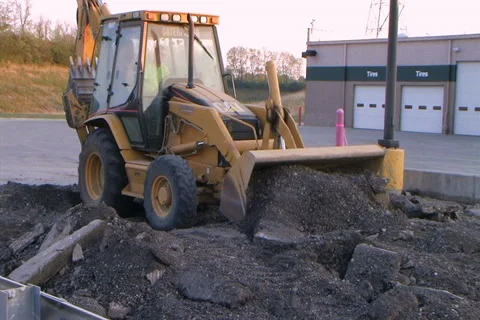 Backhoe Loader Pushing Pavement Stock-Footage 2770148