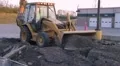 Backhoe Loader Pushing Pavement HD Footage