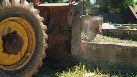 Backhoe Loader Wheel Beside Old Concrete Foundation Stock Footage 337830244