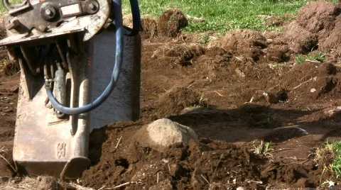 Backhoe move stone Stock Footage 703699
