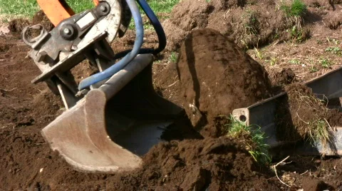 Backhoe move stone  Stock Footage 703728