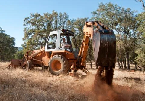 Backhoe out in the field Stock Photos