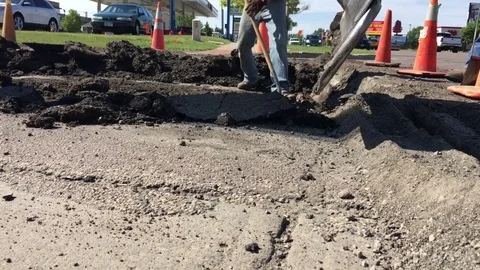 Backhoe Scraping Road Close Up 動画素材 77143501