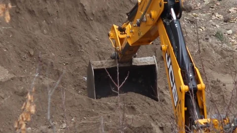 Backhoe tractor works on a construction site, november 2014 in Kyiv. Stock Footage 71042262
